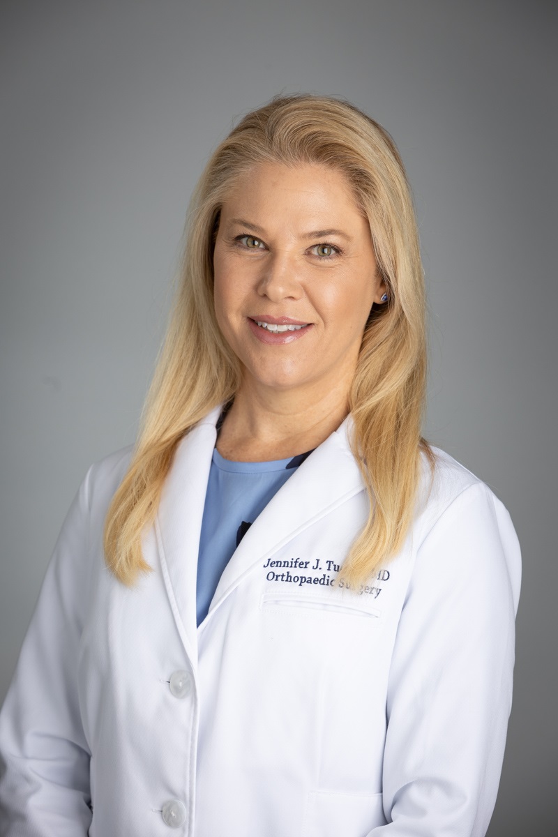 <img src="orthopedicsurgeon.jpg" alt="Dr. Jennifer Tucker" />