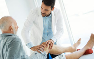 Orthopaedic surgeon examine the patient for knee arthritis