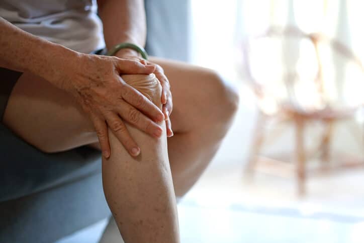Senior Woman suffering with Knee Pain