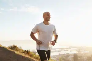 Male exercising outside to promote joint health.