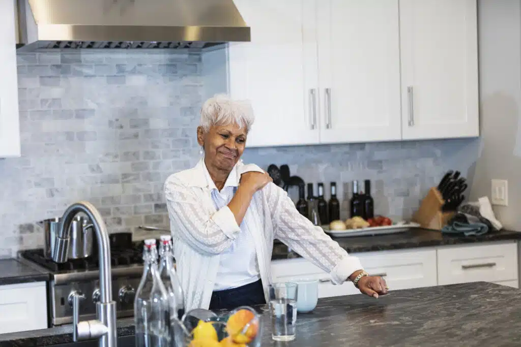 Senior African-American woman with tendonitis