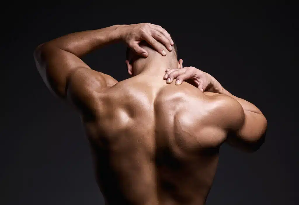picture of a muscular young man with a pulled back muscle.