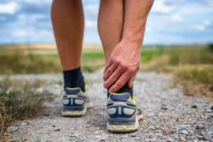 A jogger experiencing pain in the Achilles tendon may be suffering from an Achilles tendon tear.