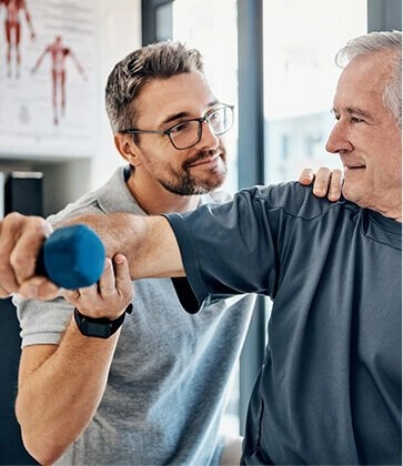 sports medicine physicians helping senior Man In exercise